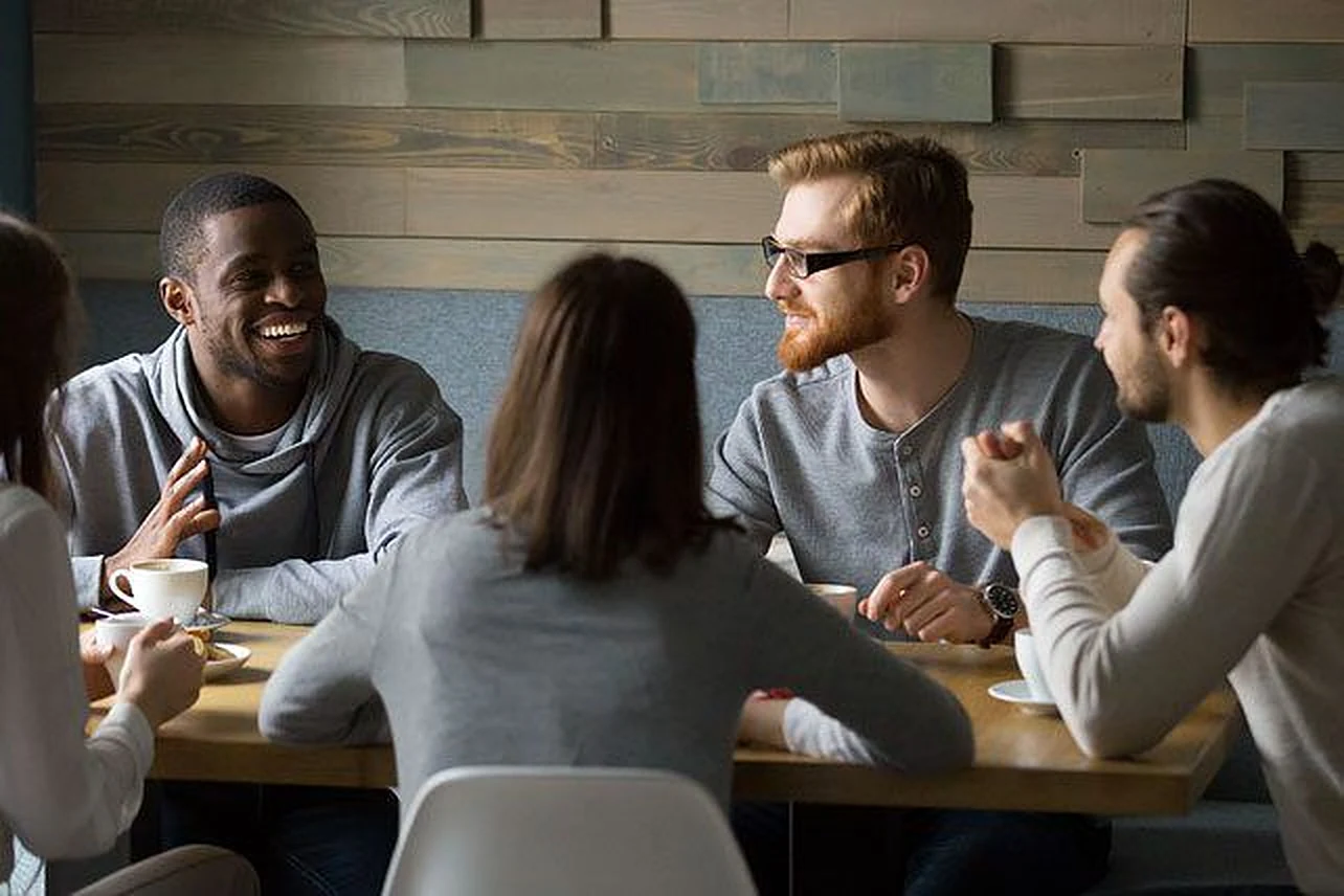 A small team talking around a table
