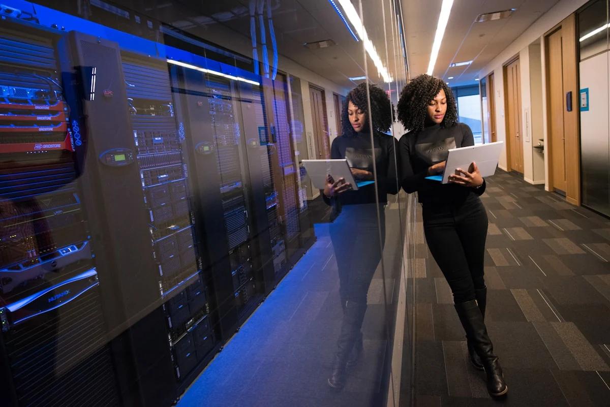 Data center aisle with rows of networking hardware
